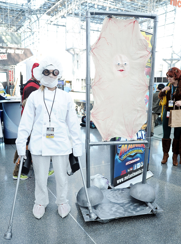 NEW YORK, NY - OCTOBER 12: A Comic Con attendee poses as characters during the 2014 New York Comic Con at Jacob Javitz Center on October 12, 2014 in New York City. (Photo by Daniel Zuchnik/Getty Images)